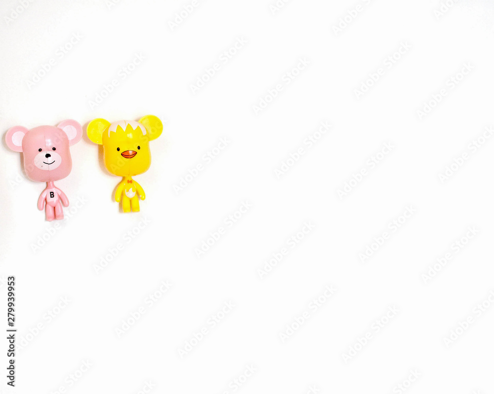 Plastic bear on a white wall background Plastic bear on a white wall background