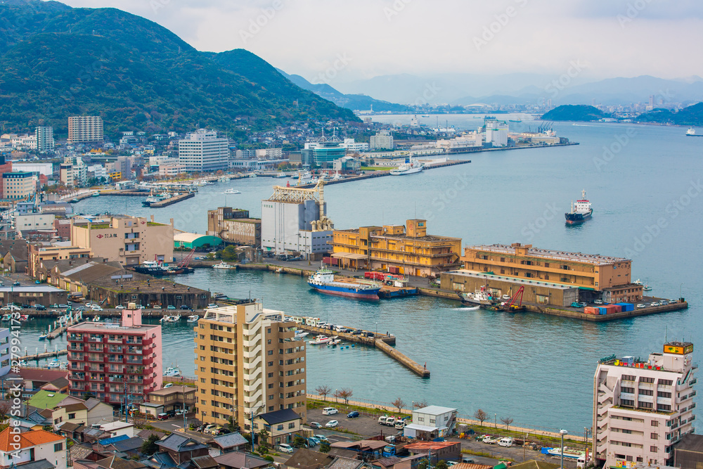 Kitakyushu, Japan - 20 November 2016: A view of Mojiko Port, a large port city and commercial center Viewed from the Kanmon Strait and Kanmonkyo Bridge