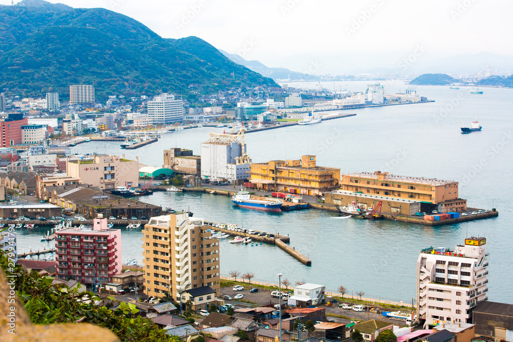 Kitakyushu, Japan - 20 November 2016: A view of Mojiko Port, a large port city and commercial center Viewed from the Kanmon Strait and Kanmonkyo Bridge