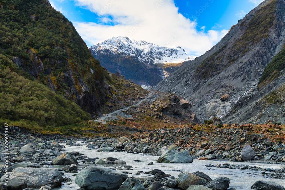 Fox glacier at new zealand. High mountains in valleys and glaciers in the morning with beautiful skies.