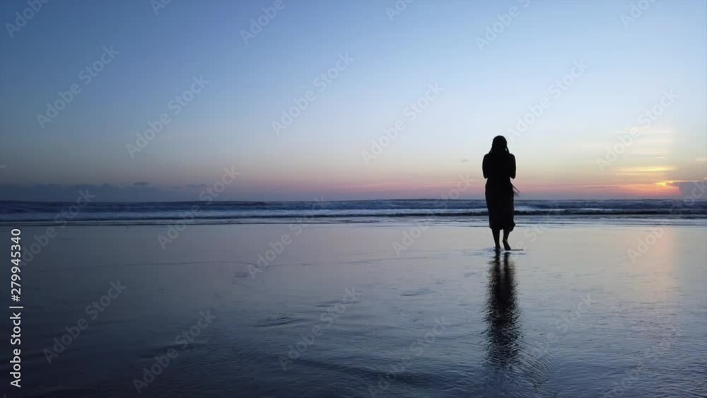 Black girl with beautiful braids does yoga pose during sunset on a beach in Bali, Indonesia Black girl with beautiful braids does yoga pose during sunset on a beach in Bali, Indonesia