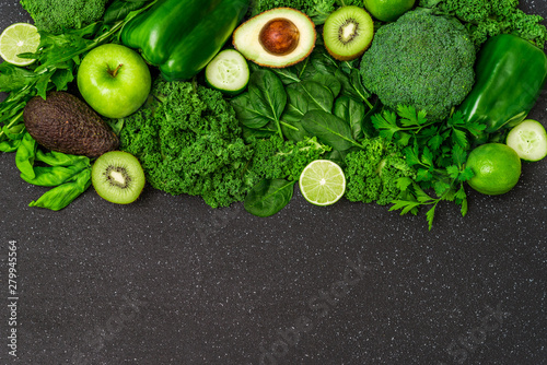 Selection of healthy green food fresh vegetables and fruit. Concept of green color, clean eating, vegetarian and vegan food and cuisine, lifestyle, diet, and fitness