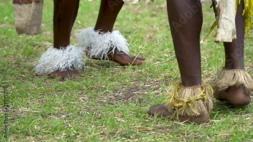 Close up legs and feet of male sing-sing dancers, Papua New Guinea photo