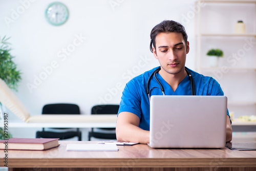 Young male doctor in telehealth concept