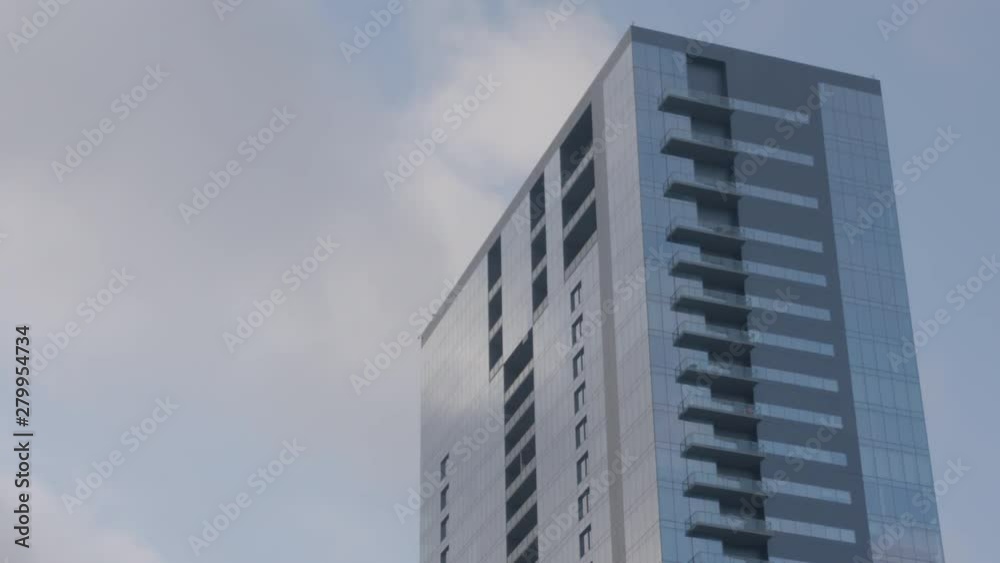 Clouds pass over tall building in Austin, Texas Clouds pass over tall building in Austin, Texas