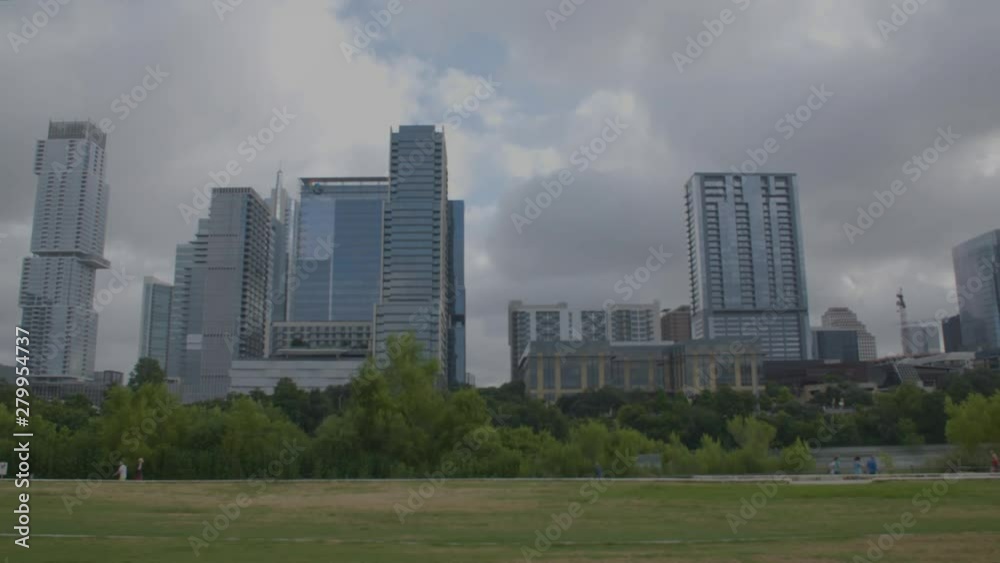 Locked off shot of Austin, Texas skyline with people walking in background (1080) Locked off shot of Austin, Texas skyline with people walking in background (1080)