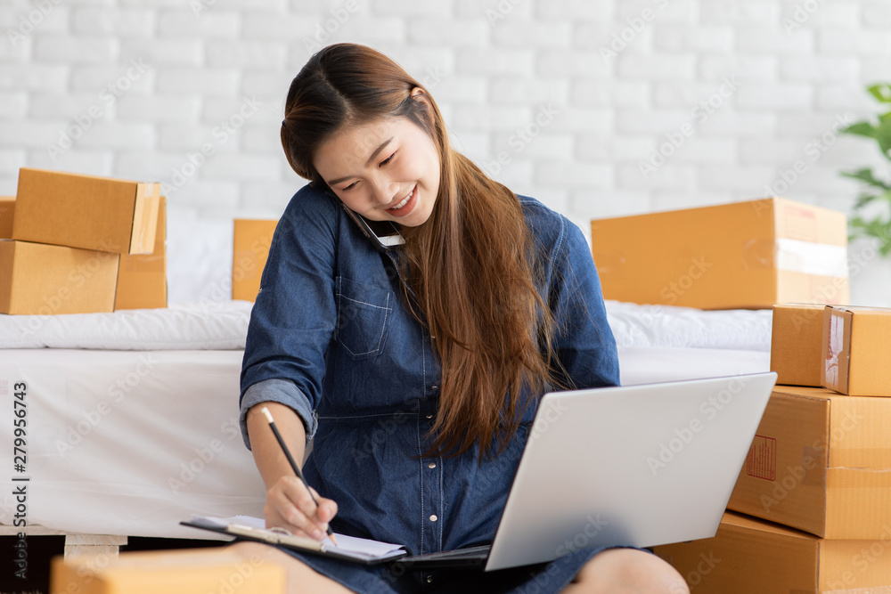 SME entrepreneur of Young Asian women working with laptop for Online shopping at home and talking with customer to delivery order,Own Business Start up for Business Online and Online shopping SME entrepreneur of Young Asian women working with laptop for Online shopping at home and talking with customer to delivery order,Own Business Start up for Business Online and Online shopping