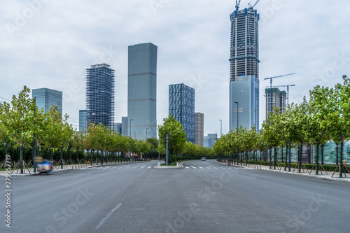 empty urban road with modern building in the city.
