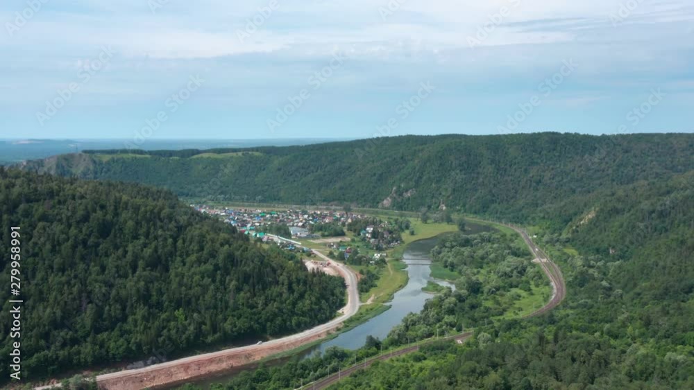Mountains.The camera follows the river and railroad , and approach the village.Panoramic view of the forest on the mountains.Type 2. Mountains.The camera follows the river and railroad , and approach the village.Panoramic view of the forest on the mountains.Type 2.