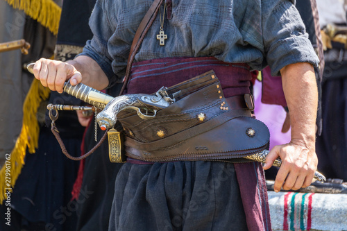 Haidutin belt with gun and sabre photo