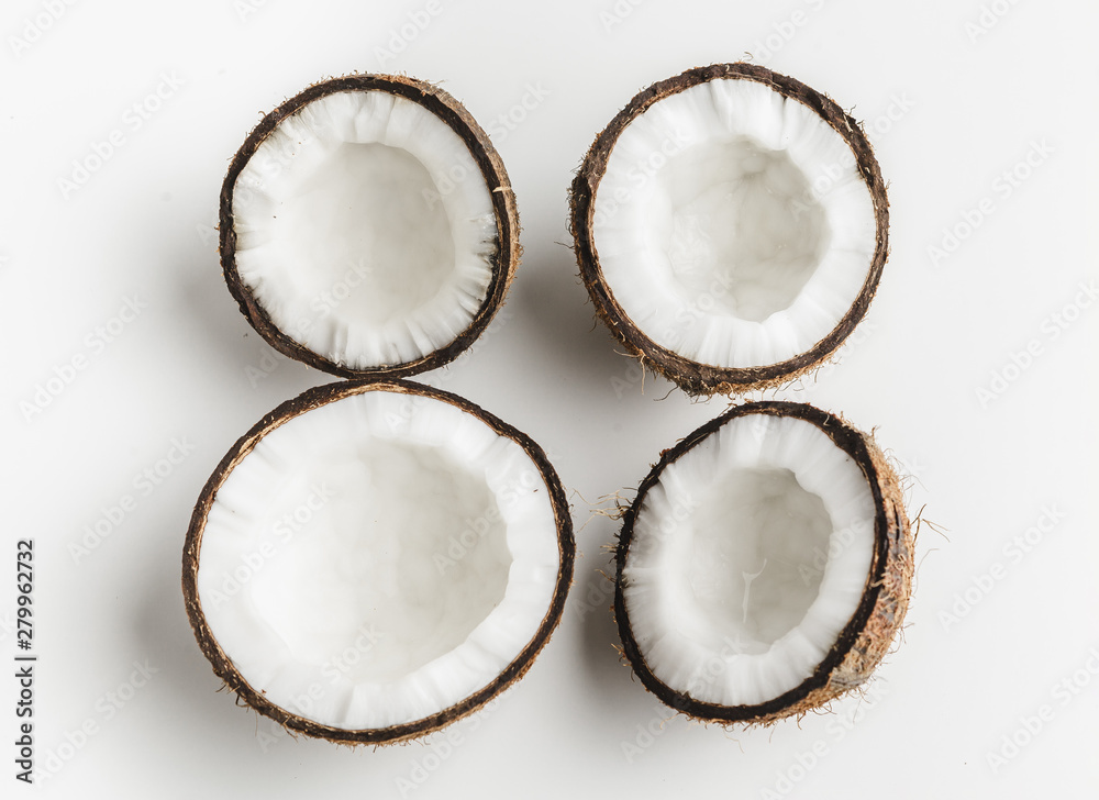 Ripe coconut pieces on white background, copy space Ripe coconut pieces on white background, copy space