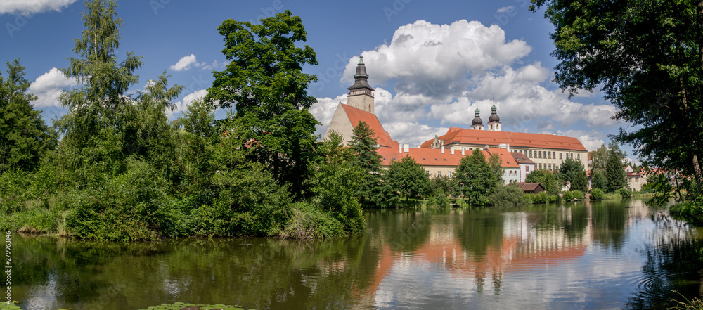 UNESCO protected Czech city Telc city scape on the castle with water reflection