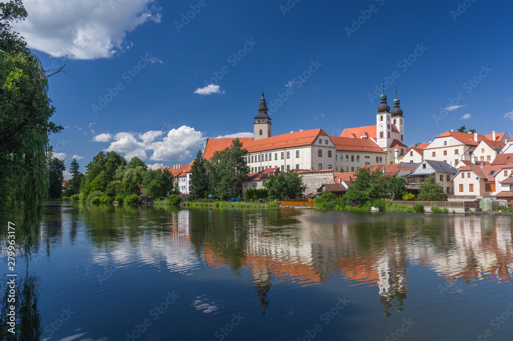 UNESCO protected Czech city Telc city scape on the castle with water reflection