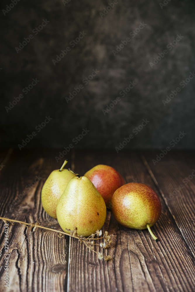 Front view of delicious pears on wooden table