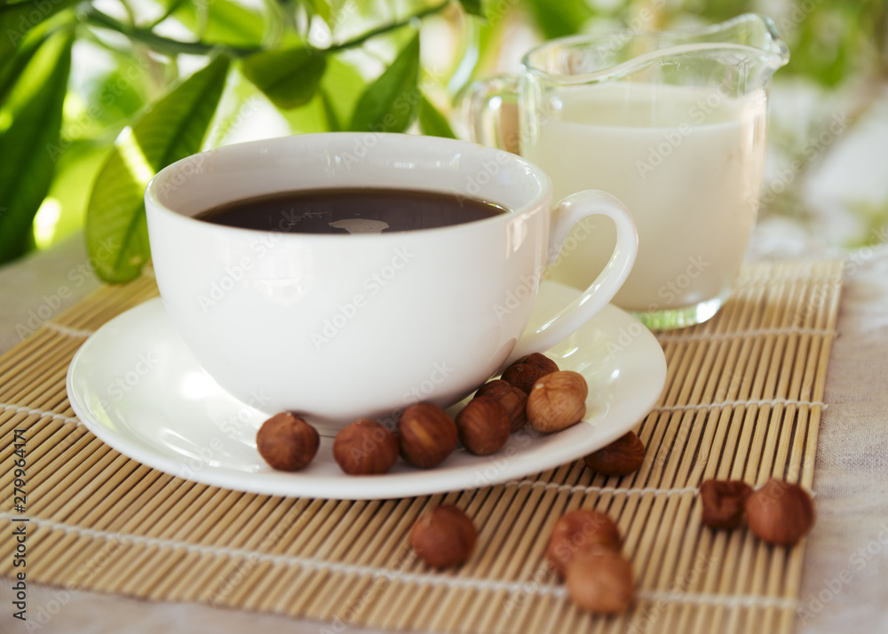 Coffee and nuts on bamboo mat Coffee and nuts on bamboo mat