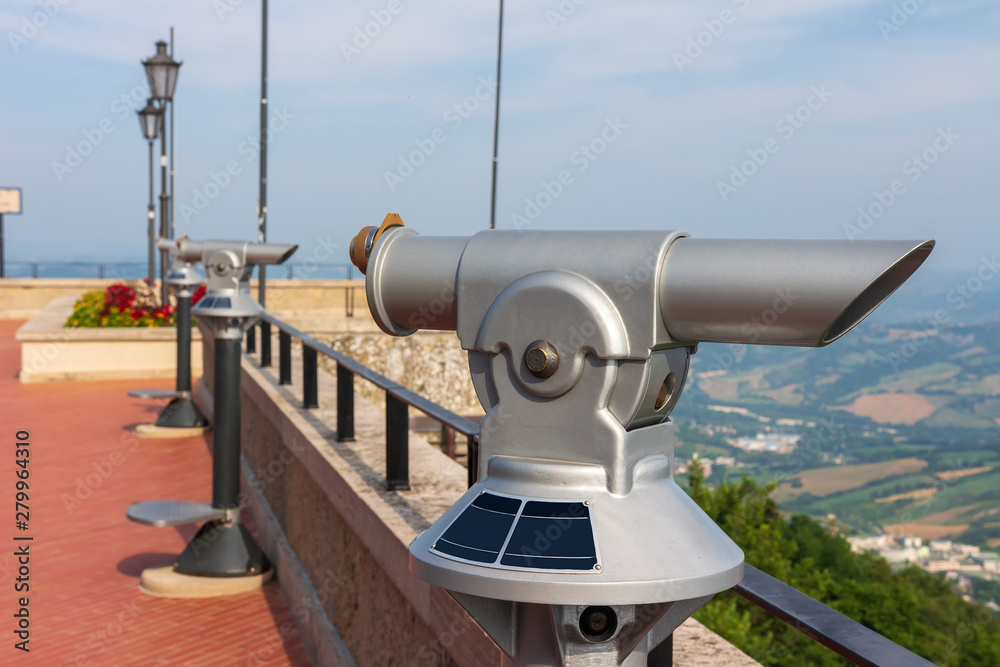 San Marino observation deck with telescope. Monocular for look on San Marino city from hill. Italy landmark