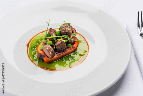 fried bell pepper stuffed with beef slices with fresh peas and basil sauce