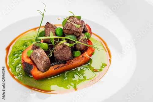 fried bell pepper stuffed with beef slices with fresh peas and basil sauce