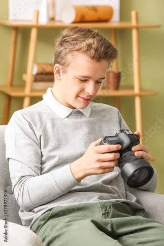 Teenage boy with photo came...