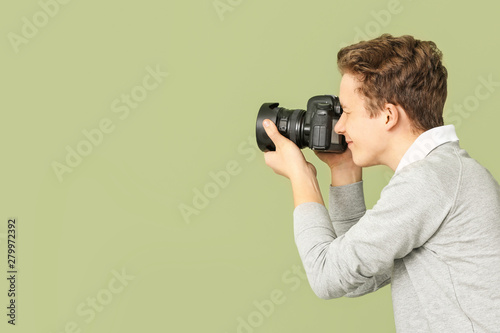 Teenage boy with photo came...