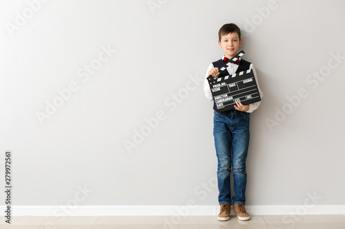 Little boy with clapperboar...