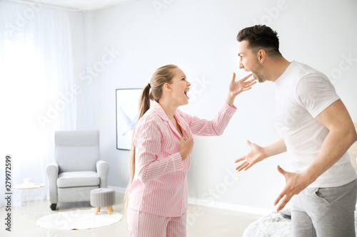 Young couple quarrelling in...