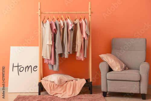 Rack with hanging clothes i...