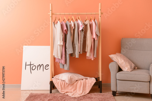 Rack with hanging clothes i...