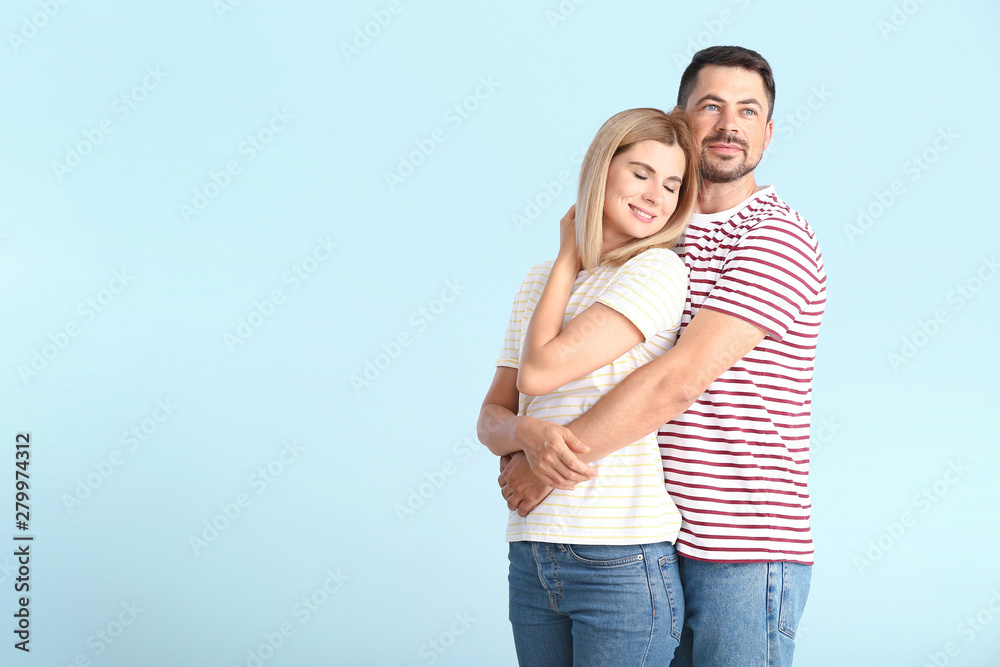 Portrait of happy couple in love on light background Portrait of happy couple in love on light background