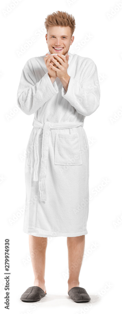 Handsome young man in bathrobe drinking coffee on white background Handsome young man in bathrobe drinking coffee on white background