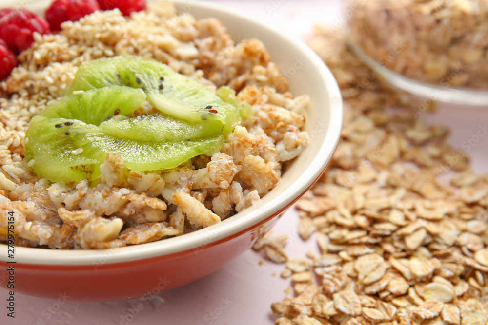 Bowl with tasty sweet oatmeal on light background Bowl with tasty sweet oatmeal on light background