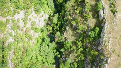 Wallpaper Mural Aerial drone top down footage of canyon with a river and waterfalls in the mountains Torontodigital.ca