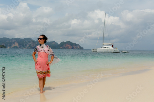 a woman so happy on beach in summer time