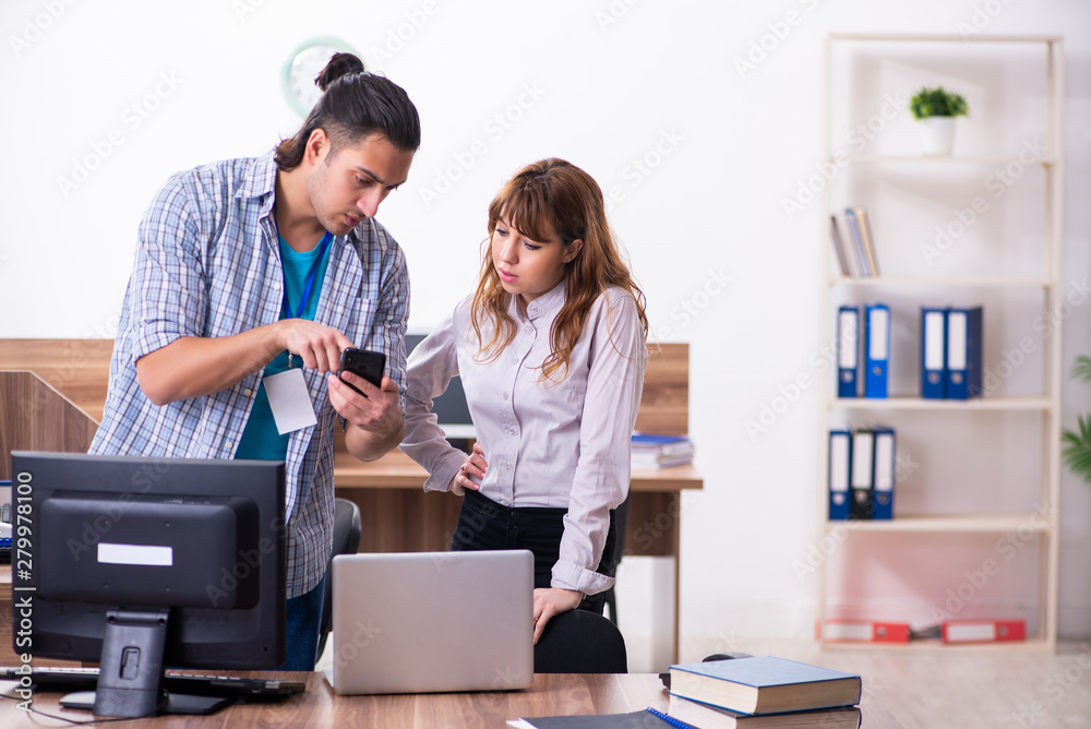 Young male it specialist in the office Young male it specialist in the office