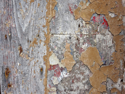 old wooden wall background with peeling paint