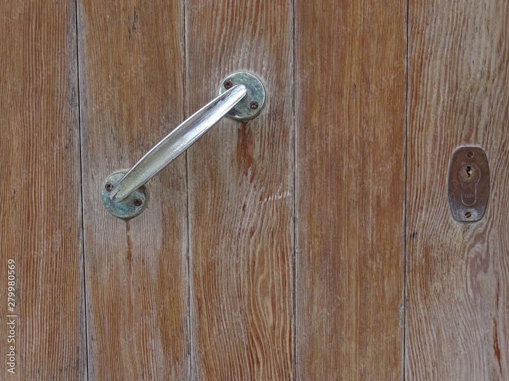Old wooden brown door with handle Old wooden brown door with handle