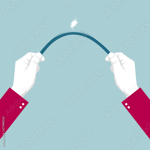 Fold the wooden stick with both hands. Isolated on blue background.