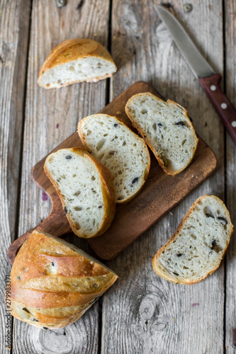 sliced sourdough bread loaf on the wooden table flat lay