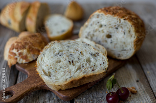 sliced sourdough bread loaf on the wooden table flat lay