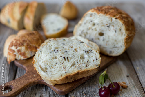 sliced sourdough bread loaf on the wooden table flat lay