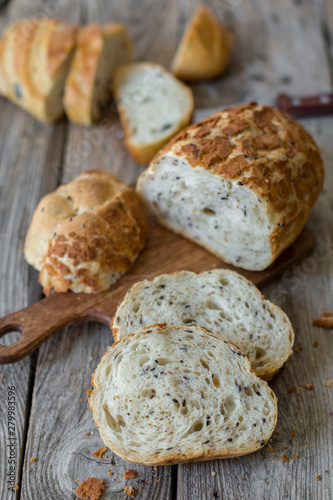 sliced sourdough bread loaf on the wooden table flat lay