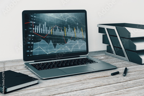 Laptop closeup with forex graph on computer screen. Financial trading and education concept. 3d rendering. © Andrey