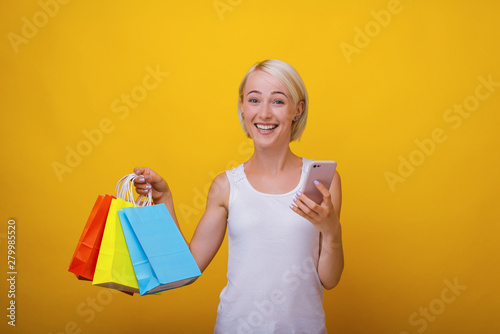 Shopping concept, A happy young woman, is proud aboud her online shop photo