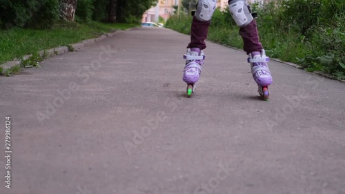 Wallpaper Mural Teenage roller skating, close-up only rollers and legs Torontodigital.ca