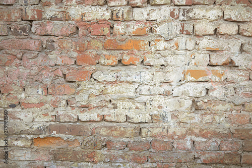 Old red brick wall with white paint background