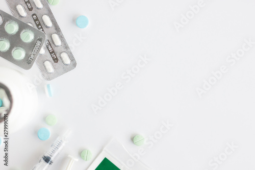 Top view image of syringe with pill on white background