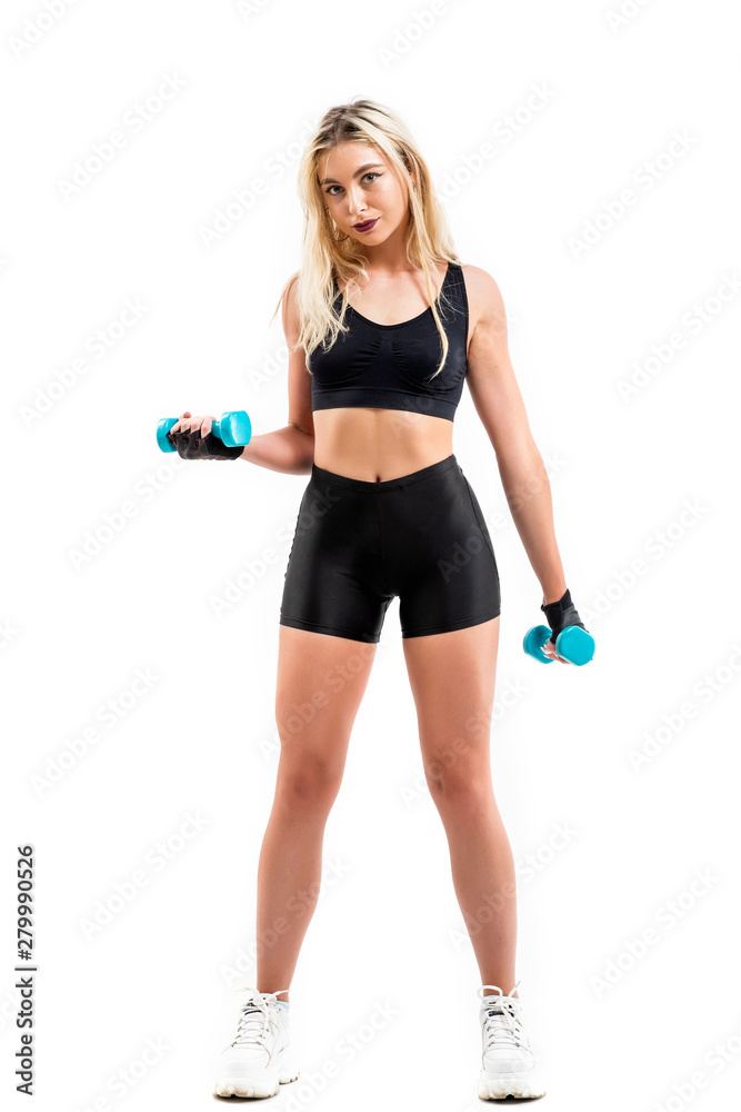 Beautiful fit woman exercising with dumbbells Beautiful fit woman exercising with dumbbells