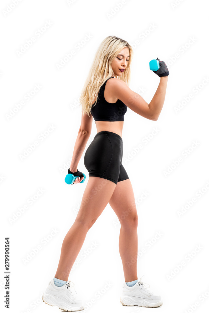 Beautiful fit woman exercising with dumbbells Beautiful fit woman exercising with dumbbells