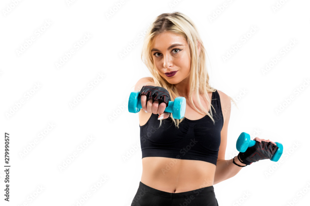 Beautiful fit woman exercising with dumbbells Beautiful fit woman exercising with dumbbells