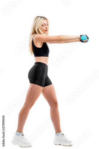 Beautiful fit woman exercising with dumbbells © czamfir